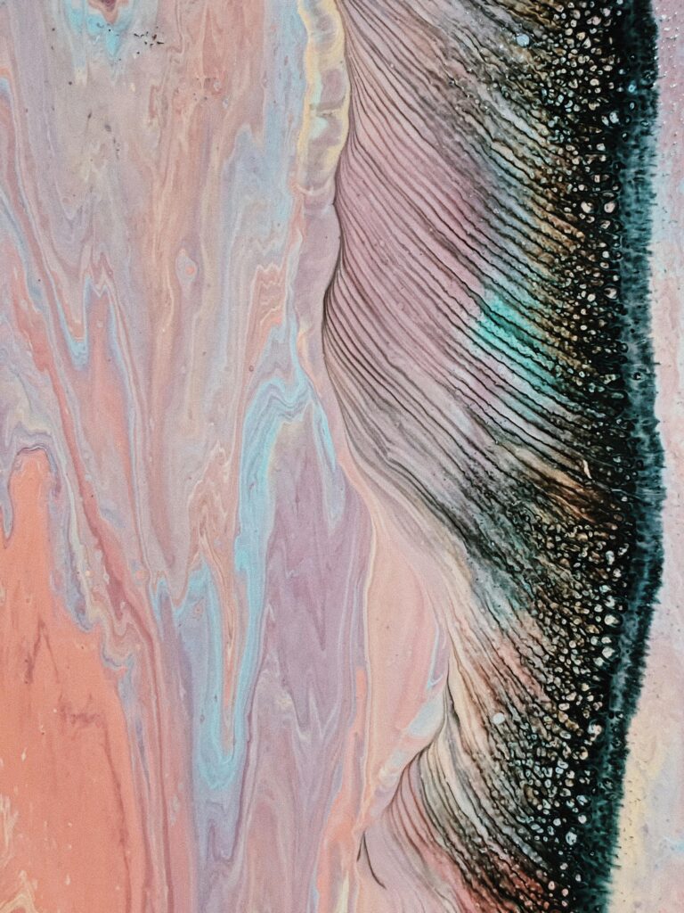 pexels-photo-3954009-3954009 Vibrant abstract marbled painting with pink and blue swirls and black details.